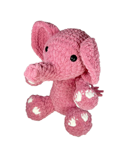 Pink crochet elephant from an angle.