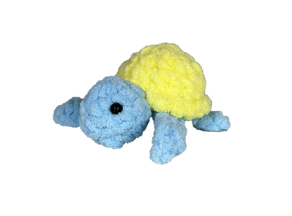 Blue crochet turtle with a yellow shell.