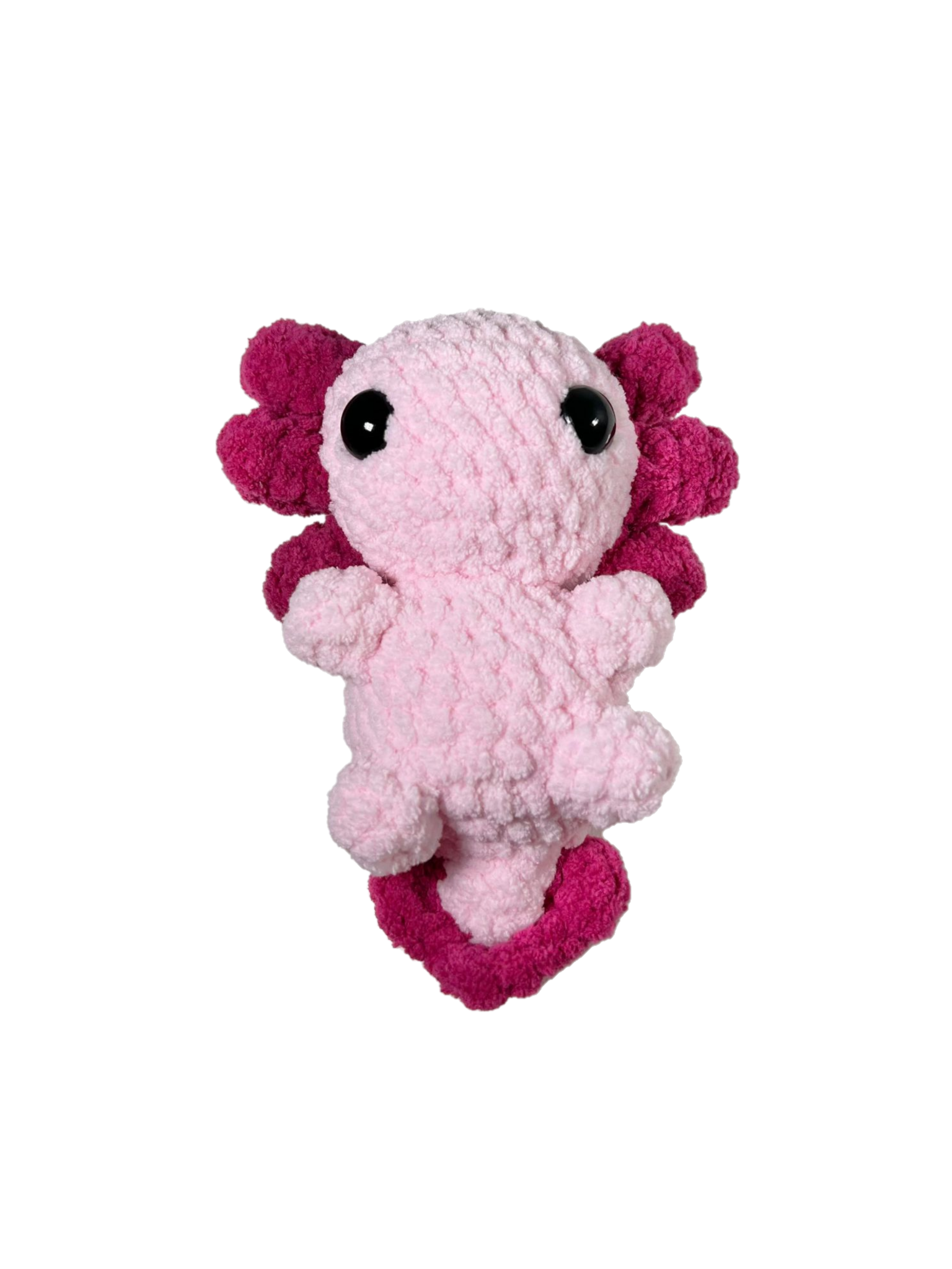 Pink crochet axolotl with white background.