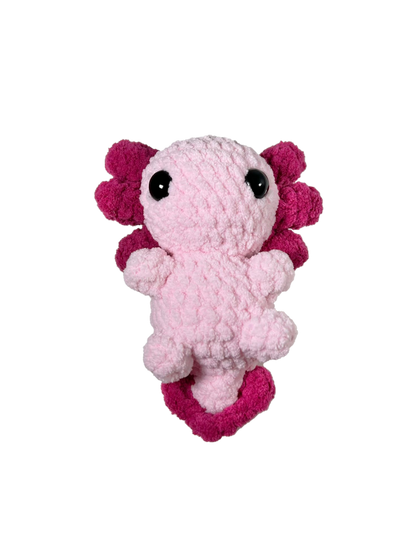 Pink crochet axolotl with white background.