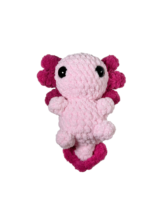 Pink crochet axolotl with white background.