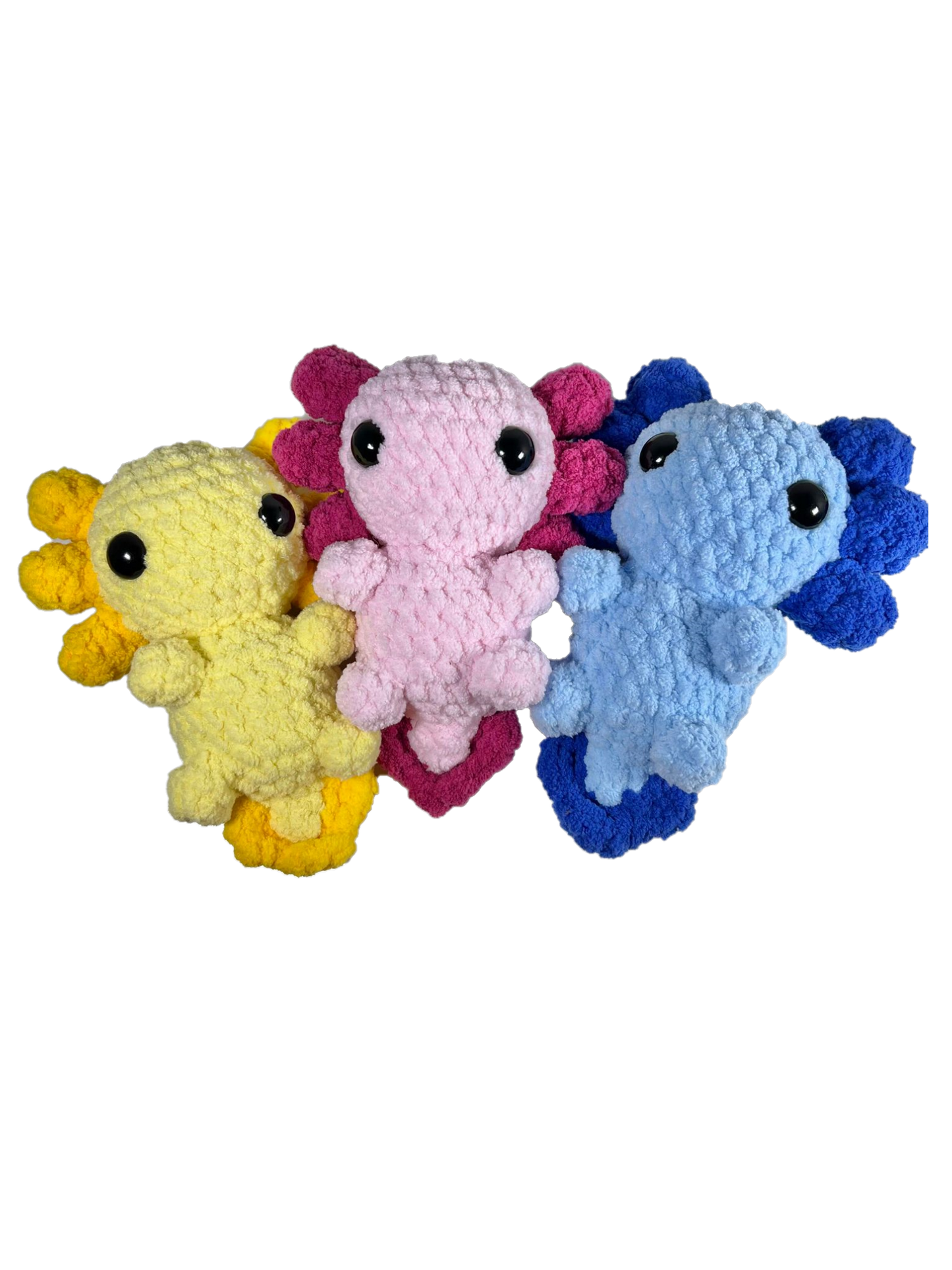 Three crochet axolotl standing next to each other with the colors yellow, pink, and blue.