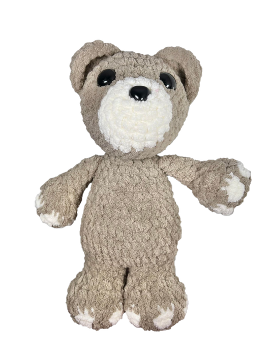 Brown crochet bear standing.