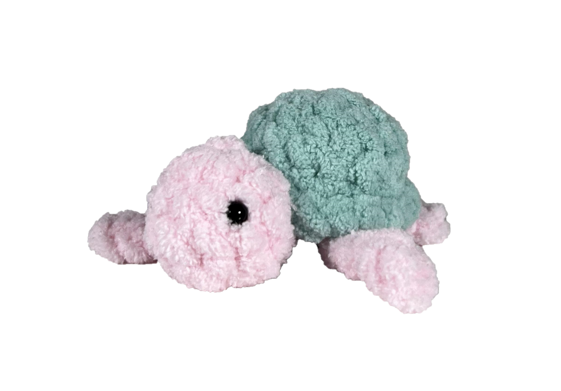 Pink crochet turtle with a green shell.