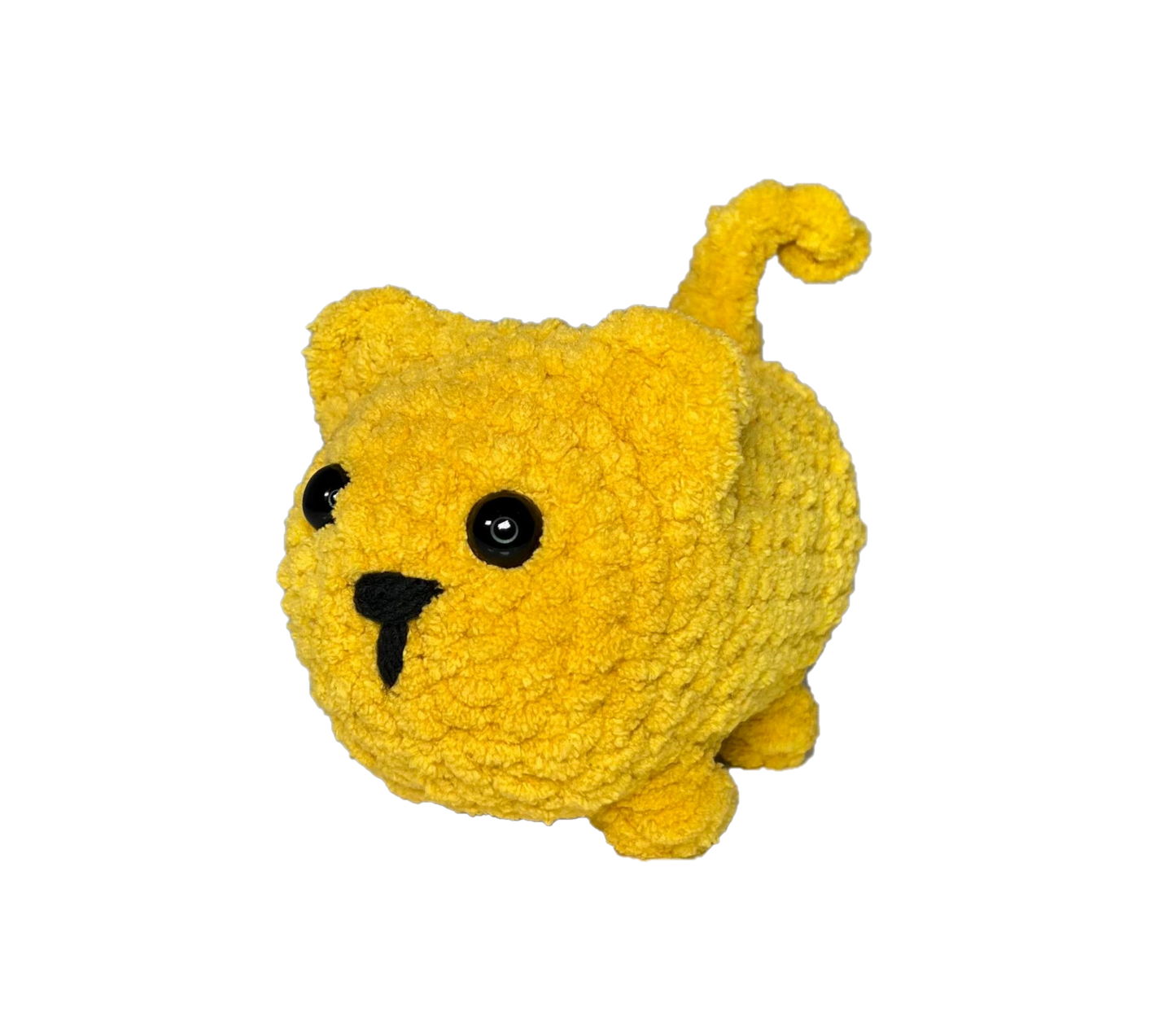 Chunky yellow crochet cat standing on four legs.