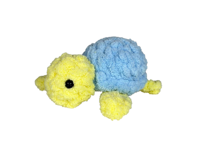 Yellow crochet turtle with a blue shell.